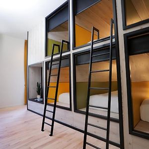Capsulehotel met een Gezamenlijke Badkamer